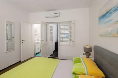 Krevet ili kreveti u jedinici u objektu Lemonade Beach Apartments