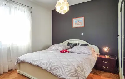 Krevet ili kreveti u jedinici u objektu One-Bedroom Apartment Dugi Rat With Sea View 06