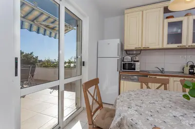 Kuhinja ili čajna kuhinja u objektu Apartment Tasina