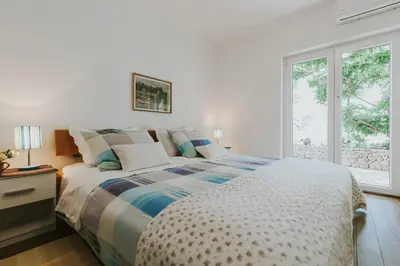 Krevet ili kreveti u jedinici u objektu First Row Seafront Apartments in Stanići