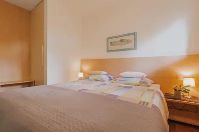 Krevet ili kreveti u jedinici u objektu First Row Seafront Apartments in Stanići