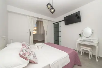 Krevet ili kreveti u jedinici u objektu Apartment 3 Vera i Ćiro Novak, sea view and free parking