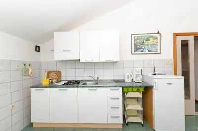 Kuhinja ili čajna kuhinja u objektu Apartment and Rooms Mate