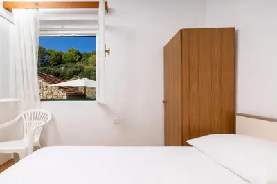 Krevet ili kreveti u jedinici u objektu Seaside secluded apartments Cove Torac, Hvar - 589