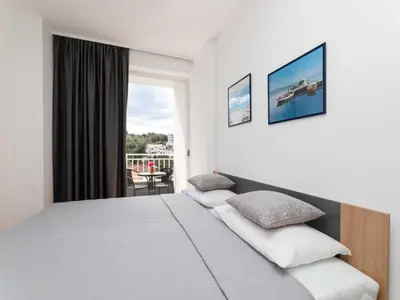 Krevet ili kreveti u jedinici u objektu Villa Supetar Garden - Two Bedroom Apartment with Terrace