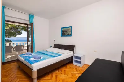 Krevet ili kreveti u jedinici u objektu Siesta Beachfront Apartments