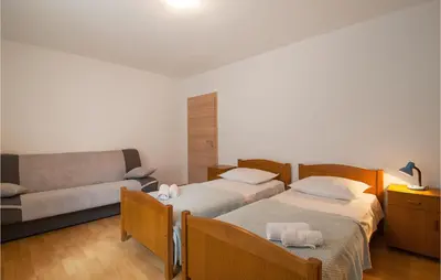Krevet ili kreveti u jedinici u objektu Three-Bedroom Apartment In Dugi Rat