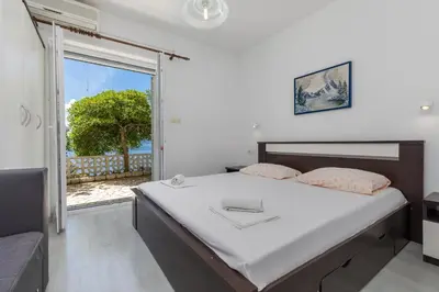 Krevet ili kreveti u jedinici u objektu Apartments by the sea Brela, Makarska - 24541
