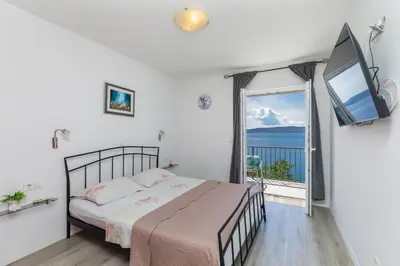 Krevet ili kreveti u jedinici u objektu Apartments by the sea Brela, Makarska - 24541