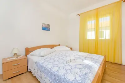 Krevet ili kreveti u jedinici u objektu Apartments and Rooms Stjepan