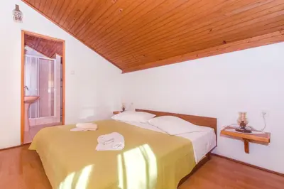 Krevet ili kreveti u jedinici u objektu Apartments and Rooms Stjepan