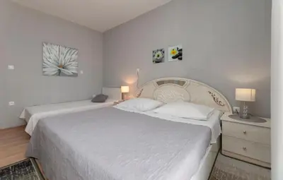 Krevet ili kreveti u jedinici u objektu Apartment and Rooms Tatijana