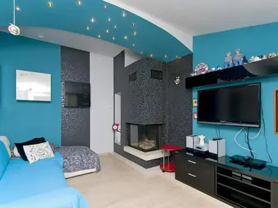 TV i/ili zabavni centar u objektu Three Bedroom Villa With Private Pool