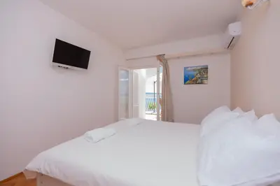 Krevet ili kreveti u jedinici u objektu Beachfront rooms Adriatic with breakfast