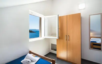 Krevet ili kreveti u jedinici u objektu Amazing Apartment In Milna With House Sea View