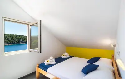 Krevet ili kreveti u jedinici u objektu Amazing Apartment In Milna With House Sea View