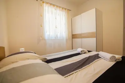 Krevet ili kreveti u jedinici u objektu Domus Apartments - Free Private Parking