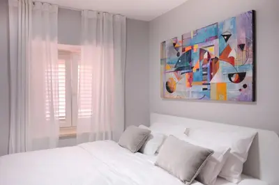 Krevet ili kreveti u jedinici u objektu NIDO Apartments