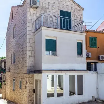 Stone house with two balconies and the sea view