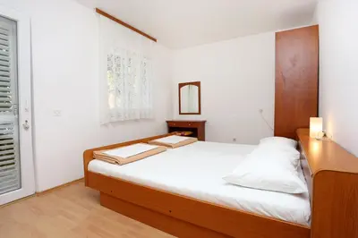 Krevet ili kreveti u jedinici u objektu Apartments by the sea Pisak, Omis - 1014