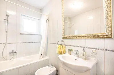 Kupaonica u objektu Apartments Sinovcic with terrace & sea view, 4 min walk to the beach