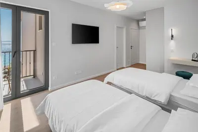 Krevet ili kreveti u jedinici u objektu NEW! Seaview Villa Bota: A Luxurious Coastal Retreat in Podstrana
