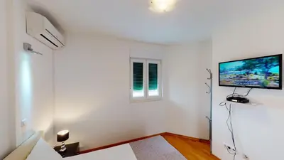 TV i/ili zabavni centar u objektu Apartments Andrea - Beachfront & Sea-view Terrace