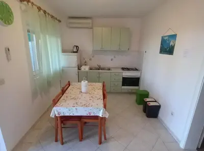 Kuhinja ili čajna kuhinja u objektu Berti Sun & Sea Apartments