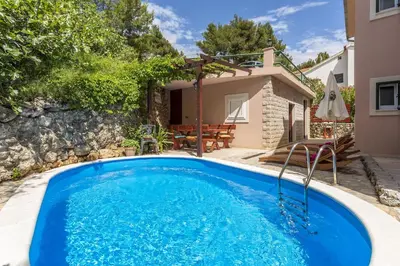 Bazen u objektu Seaside apartments with a swimming pool Medici, Omis - 7461 ili u blizini