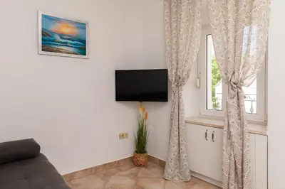 TV i/ili zabavni centar u objektu Sea view apartment Galatea