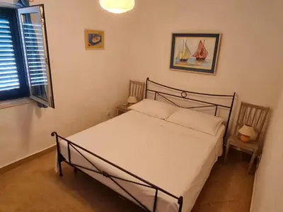 Krevet ili kreveti u jedinici u objektu Apartments Stiniva Hvar - One Bedroom Apartment With Terrace A1