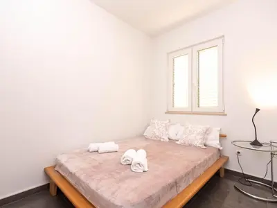 Krevet ili kreveti u jedinici u objektu Holiday Home Haus in Splitska mit kostenlosem Parkplatz by Interhome
