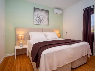 Krevet ili kreveti u jedinici u objektu Holiday Home Haus in Stanići mit grünem Garten by Interhome