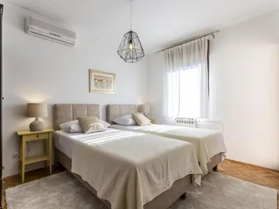 Krevet ili kreveti u jedinici u objektu Villa in Podstrana with barbecue and Wi-Fi