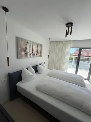 Krevet ili kreveti u jedinici u objektu Villa Čapula - Modern Apartment with Sea View and Parking, Marušići