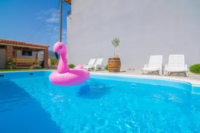 Bazen u objektu Family-friendly apartments with swimming pool Kostanje, Omis - 25072 ili u blizini