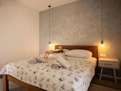 Krevet ili kreveti u jedinici u objektu Holiday Home für 12 Personen ca- 180 m² in Jesenice- Dalmatien - Gespanschaft Split-Dalm by Interhome
