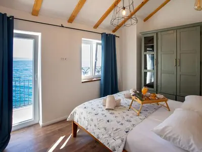 Krevet ili kreveti u jedinici u objektu Holiday Home für 12 Personen ca- 180 m² in Jesenice- Dalmatien - Gespanschaft Split-Dalm by Interhome