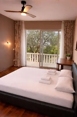 Krevet ili kreveti u jedinici u objektu Villa Palma Maris - Pool, Sea View & Private Gym