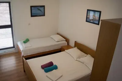Krevet ili kreveti u jedinici u objektu Apartments by the sea Lokva Rogoznica, Omis - 6005