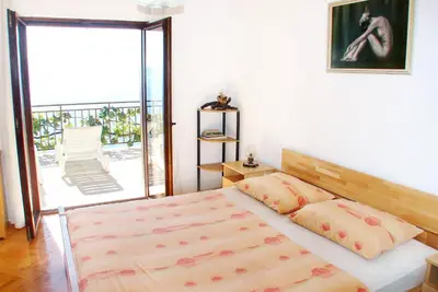 Krevet ili kreveti u jedinici u objektu Apartments by the sea Pisak, Omis - 658