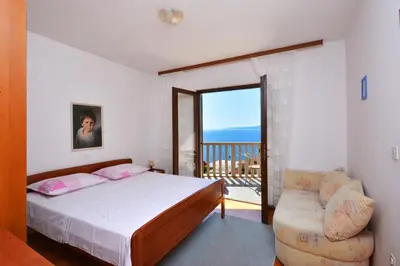 Krevet ili kreveti u jedinici u objektu Apartments by the sea Pisak, Omis - 7521