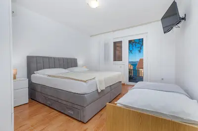 Krevet ili kreveti u jedinici u objektu Apartments and rooms by the sea Brela - Makarska - 2752