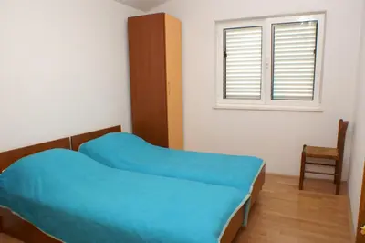 Krevet ili kreveti u jedinici u objektu Apartments by the sea Milna - Hvar - 3074