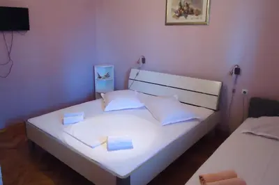 Krevet ili kreveti u jedinici u objektu Apartments and rooms by the sea Sumpetar, Omis - 2099