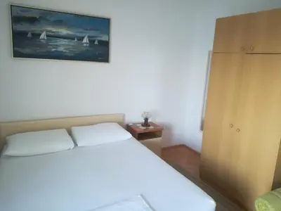 Krevet ili kreveti u jedinici u objektu Apartments by the sea Nemira, Omis - 4834