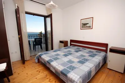 Krevet ili kreveti u jedinici u objektu Apartments by the sea Sumpetar, Omis - 4827