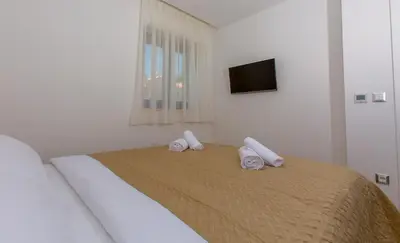 Krevet ili kreveti u jedinici u objektu Luxury Aparthotel