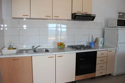 Kuhinja ili čajna kuhinja u objektu Apartments by the sea Mimice, Omis - 2774