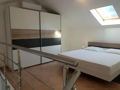 Krevet ili kreveti u jedinici u objektu Apartments Villa Maslinica